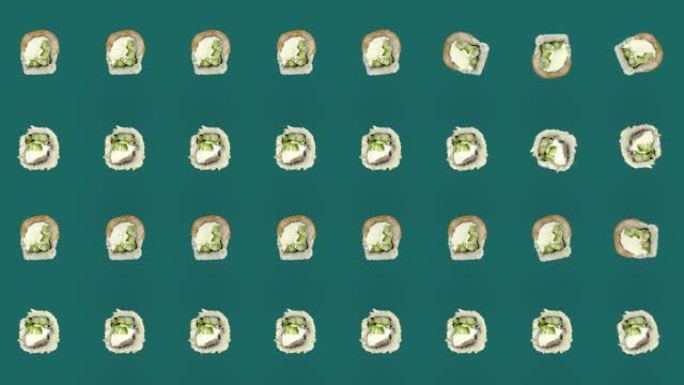 绿色背景上的日本寿司卷彩色图案。寿司无缝图案。费城劳斯莱斯。顶视图。逼真的动画。4k视频运动