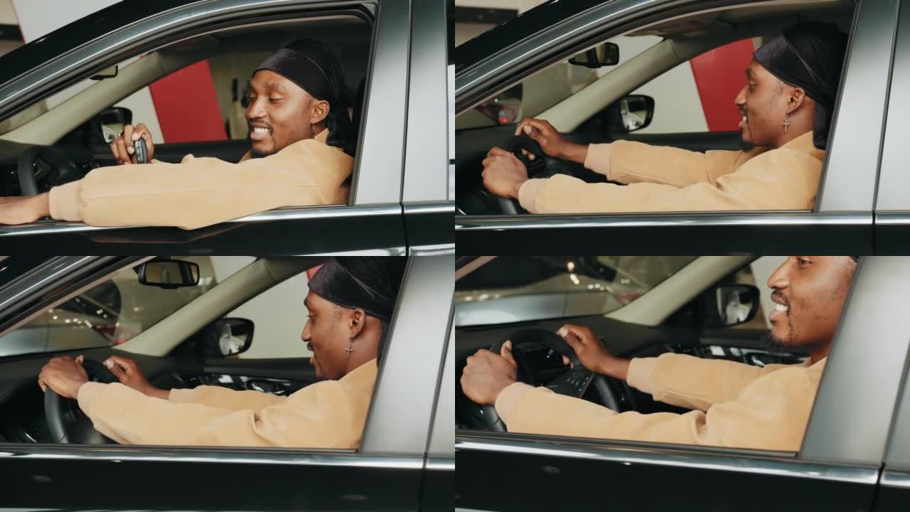 兴奋的非洲男子在他的新车里展示了一把车钥匙。参观汽车经销商。自己的车。快乐的非洲裔美国人在汽车经销店