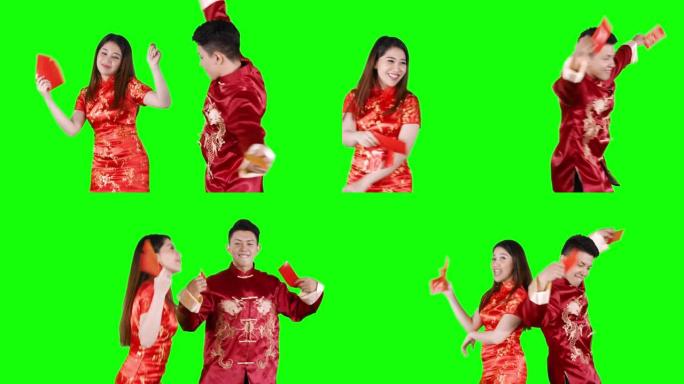快乐的亚洲情侣伴着红包跳舞