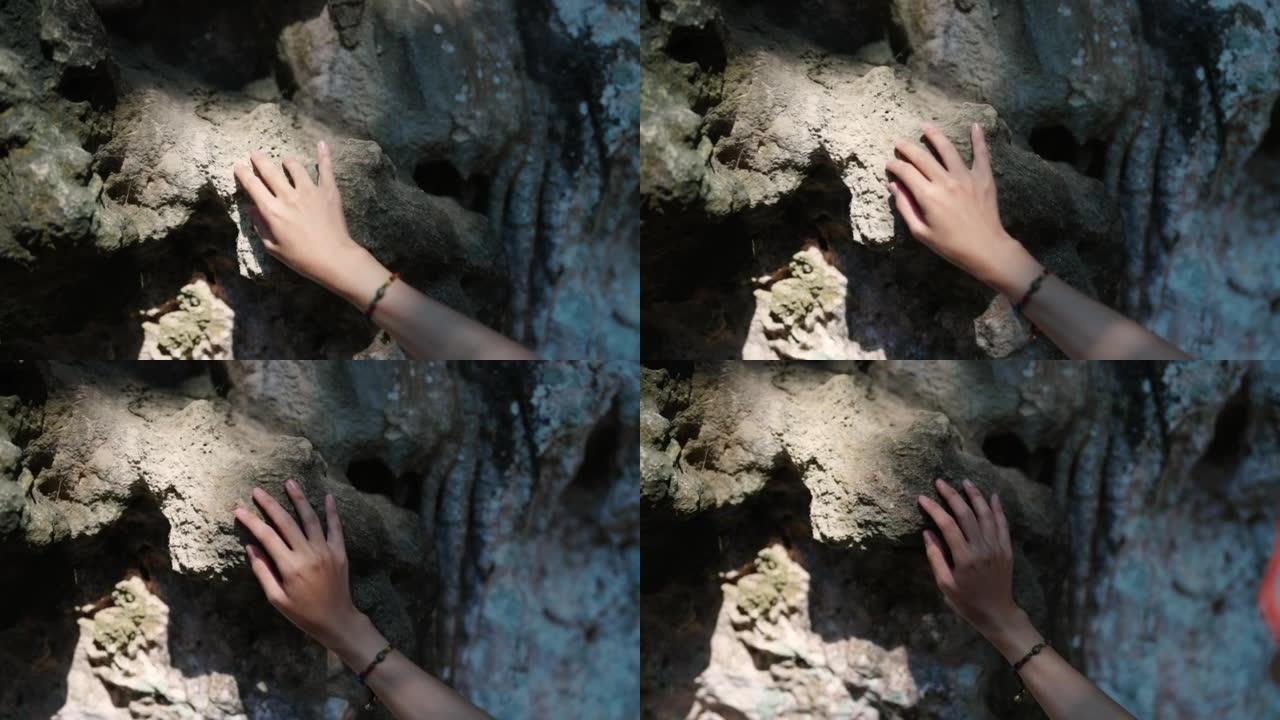 4k年轻的亚洲妇女在暑假在热带岛屿海滩的洞穴中行走
