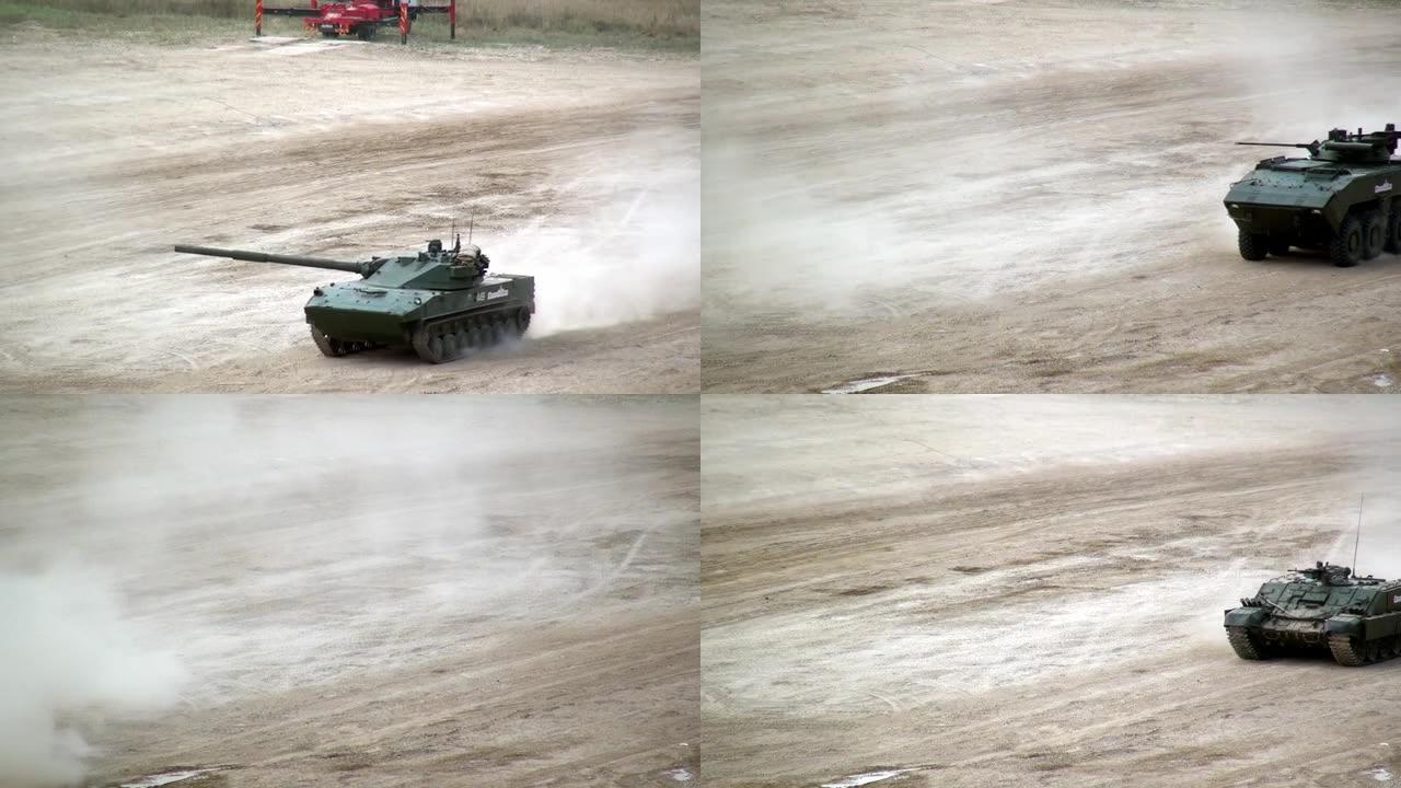 俄罗斯的坦克纵队在演习中沿着尘土飞扬的道路行进。