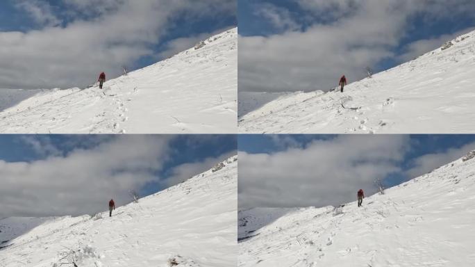 孤独的徒步旅行者攀登雪山