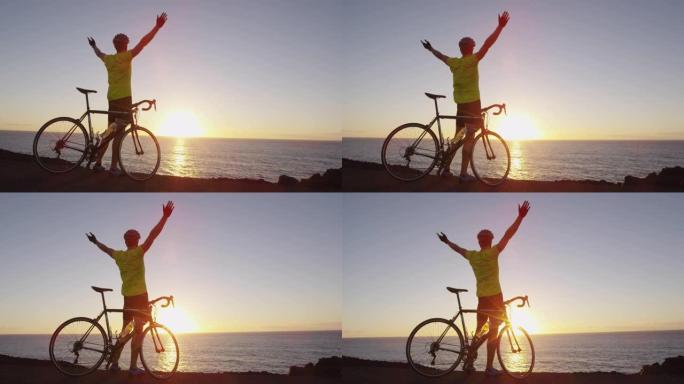 骑自行车的成功和成就 -- 男子欢呼在公路自行车上实现目标快乐。骑自行车的男性骑车人在日落时骑自行车