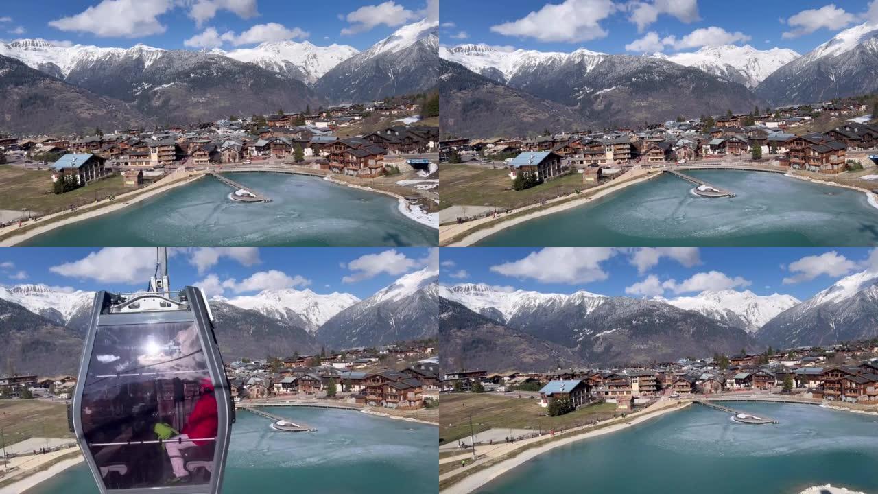 从法国阿尔卑斯山的滑雪缆车俯瞰滑雪胜地村庄