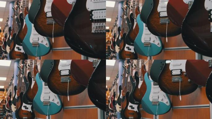 许多五彩电吉他挂在音乐商店，吉他商店