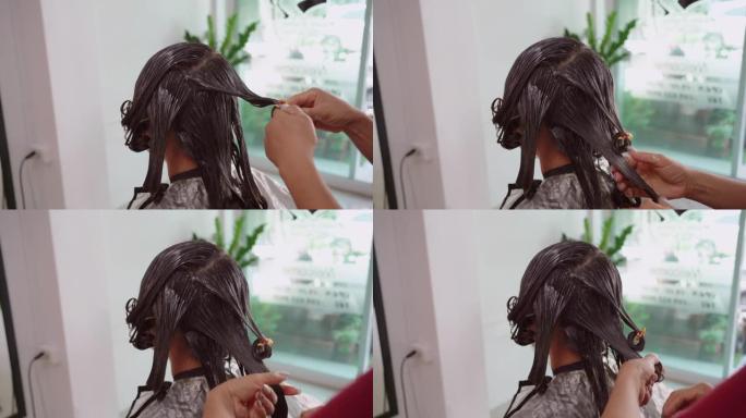 亚洲女人在卷发。