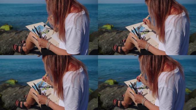 艺术疗法和冥想在海边，女人在休息和绘画海洋景观