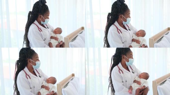 带卫生口罩的非裔美国医生将新生婴儿抱在胸前，看起来像摇篮曲婴儿在床上，房间里有白色窗帘