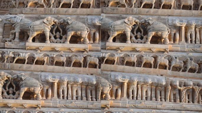 印度拉贾斯坦邦乌代布尔Jagdish寺古印度寺庙墙上的石雕特写镜头。印度历史建筑和古老的印度教寺庙墙