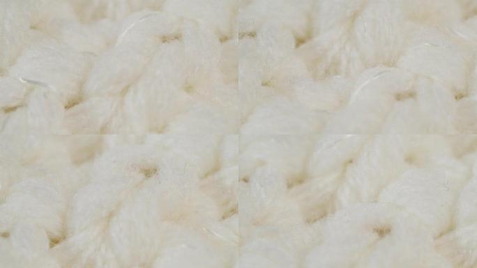 白色针织布，浅色羊毛衣服面料特写，编织纺织背景
