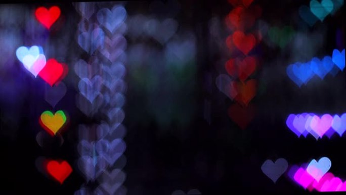 情人节4K UHD视频背景。与浪漫闪耀和闪烁的心的波克的边界深灰色背景。爱，心状的波克。