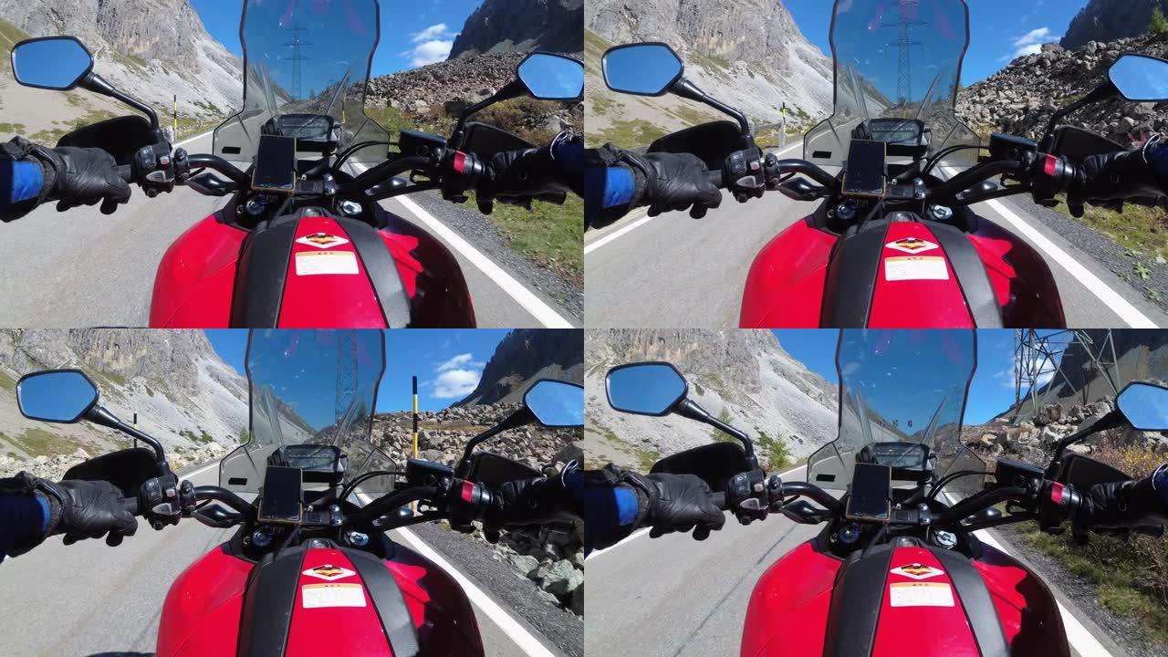 在瑞士阿尔卑斯山的风景山口骑摩托车，摩托之旅