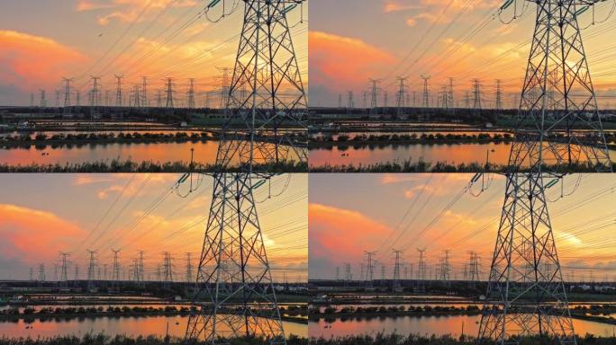 日落时高压电塔的航拍画面