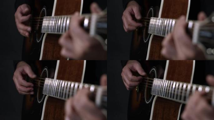 一位吉他手用手指弹拨技术演奏他的原声吉他。