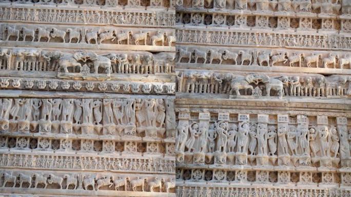 印度拉贾斯坦邦乌代普尔贾格迪什神庙墙上雕刻的特写视频。印度历史建筑和古老的印度教寺庙墙壁雕刻背景。