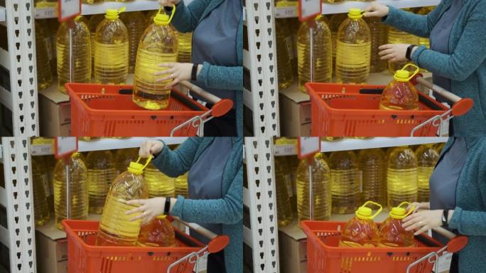 女性在商店购买葵花籽油瓶