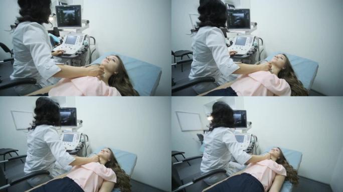 临床对年轻女性甲状腺的超声扫描诊断。女医生在病人的脖子上运行超声波传感器。
