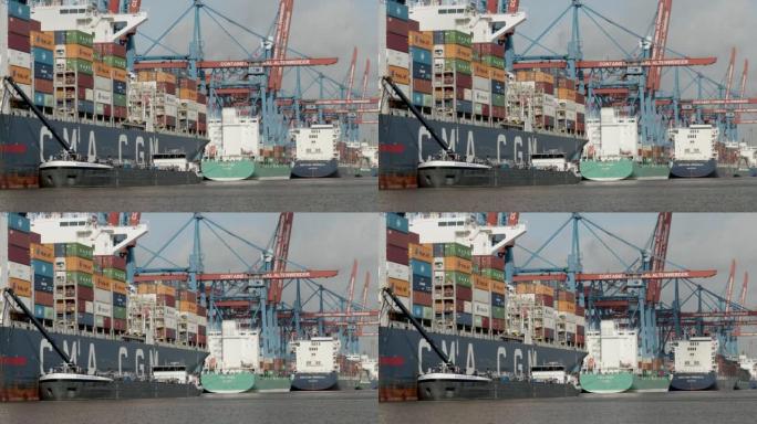 汉堡集装箱码头，配有船舶起重机和板条箱