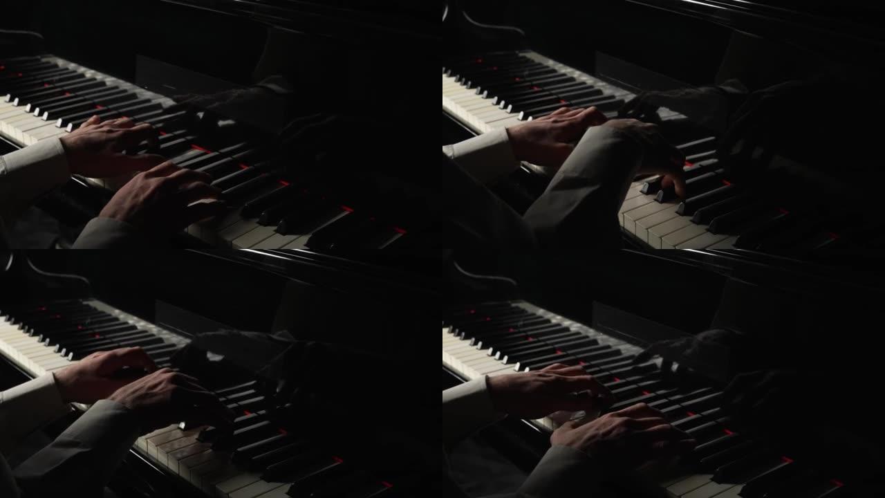 才华横溢的钢琴家在黑暗中用钢琴演奏古典旋律。人的手触摸弦乐器键盘的按键。音乐艺术家的专业表演。特写。
