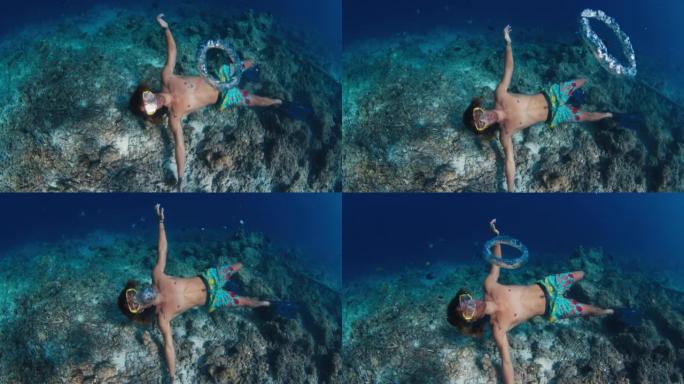 人在海里的水下吹泡泡。自由潜水者在马尔代夫水下游泳并吹环气泡