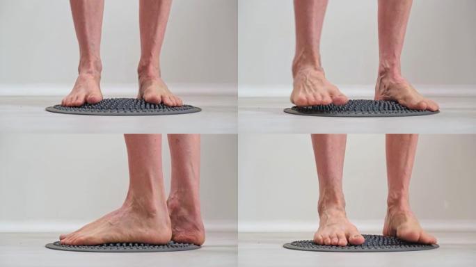 4K。裸露的男性脚践踏矫形按摩垫。预防疾病。