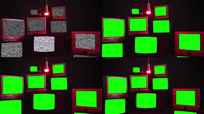 一组9台老式电视，带色度键屏幕，房间内有蓝色黑色墙壁