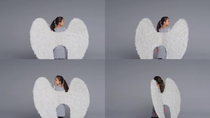 工作室镜头女孩戴着天使翅膀