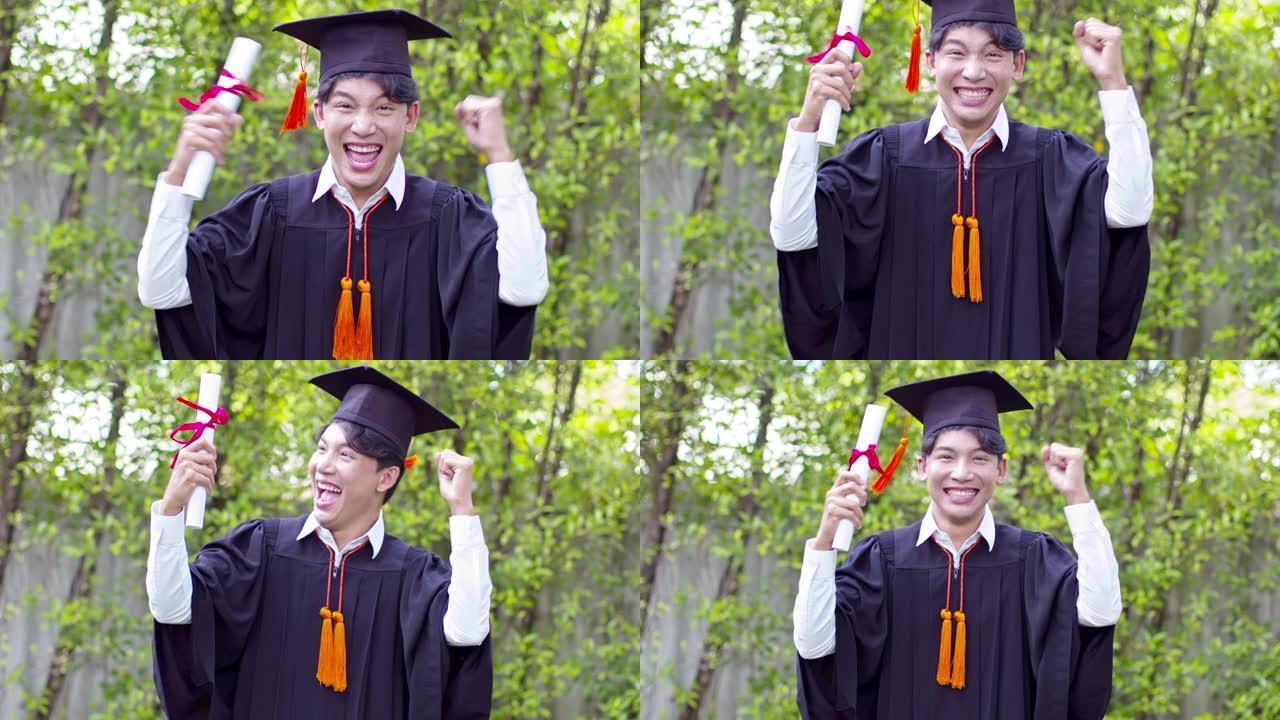 亚洲毕业男子穿着帽子和礼服，在毕业典礼上如此自豪的微笑和幸福，在毕业典礼上祝贺学生，教育成功理念