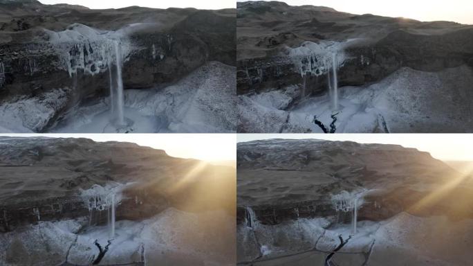 无人机揭示了冰岛日出时Seljalandsfoss瀑布的镜头