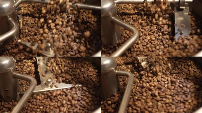 将罗布斯塔或阿拉比卡咖啡豆倒入工业焙烧炉中。咖啡豆被倒入并旋转。工业焙烧。混合咖啡粒。咖啡馆的背景。