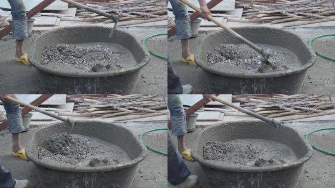 工人在建筑工地浇筑水泥。