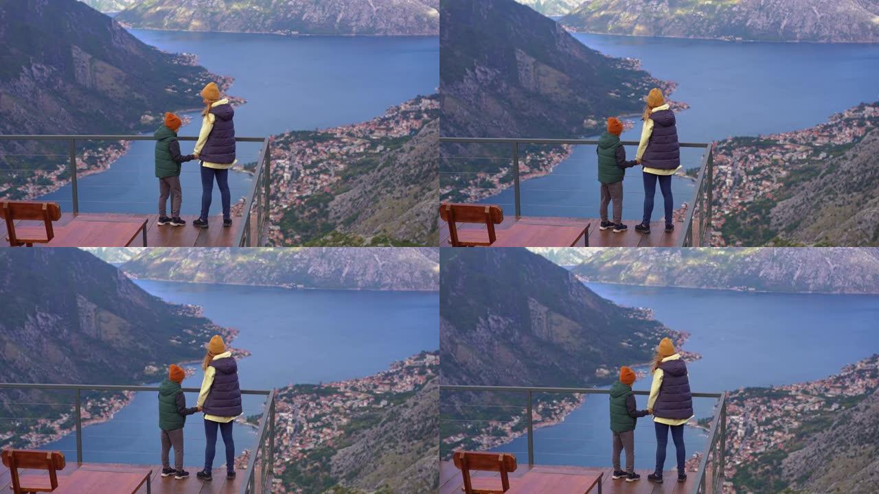 秋天，一对母子在黑山旅行。他们从山上的角度看博卡·科托尔斯卡湾