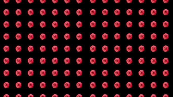 黑色背景上新鲜红色石榴的彩色水果图案。石榴无缝图案。顶视图。逼真的动画。4k视频运动