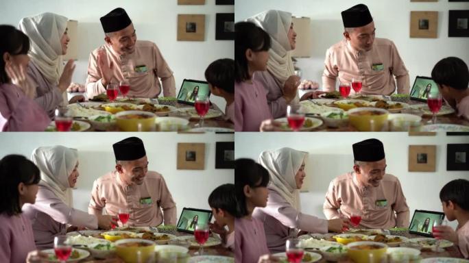 马来穆斯林家庭视频呼叫朋友和家人参加Hari Raya Aidilfitri庆祝活动