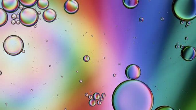 抽象彩色食品油滴气泡和球体流动