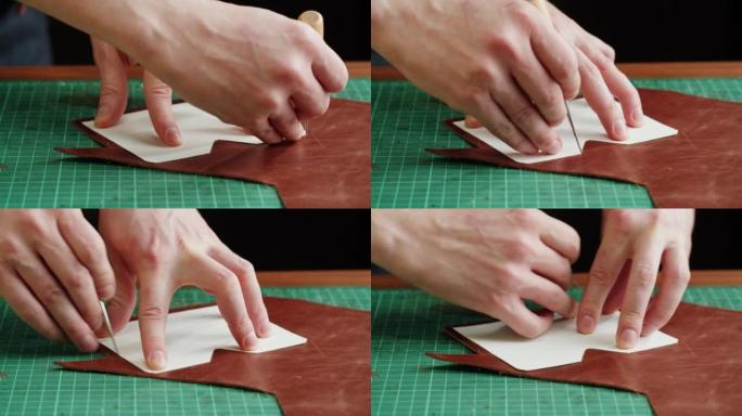 男子裁缝切割人造革与模板特写。工匠在工作场所的桌子上雕刻牛皮，制作由真皮动物皮革制成的手工产品。专业