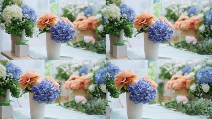 花卉花束经营店多莉镜头，美丽的鲜花绣球花白玫瑰和天然篮子在鲜花小经营店晨光桌上排列