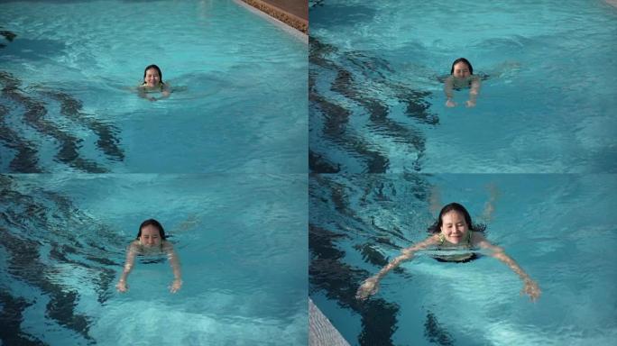 夏季的亚洲女性在游泳池里游泳