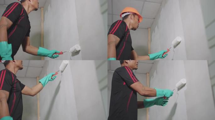 亚洲男子在家画墙宣传片实拍视频素材