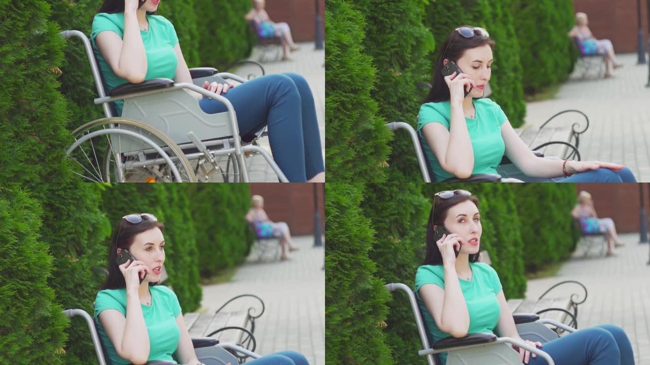 迷人的女孩坐在轮椅上讲电话，慢悠悠
