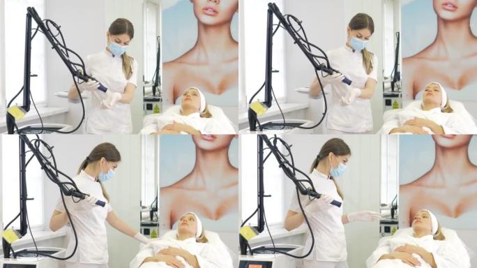 蒙面美容师-皮肤科医生为美容医学诊所的患者执行硬件激光脱毛。激光脉冲清洁皮肤。硬件美容。消除颜料。