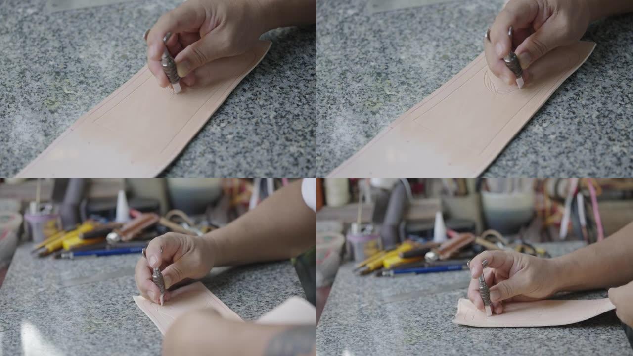 皮革床单上的工匠手工雕刻图案。