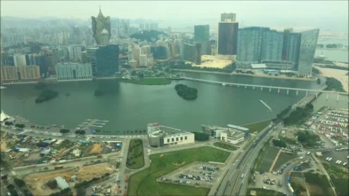 珠海市和澳门湾区的城市风光，中国阳光灿烂的日落珠海城澳门湾观景空中全景4k时间推移的中国。