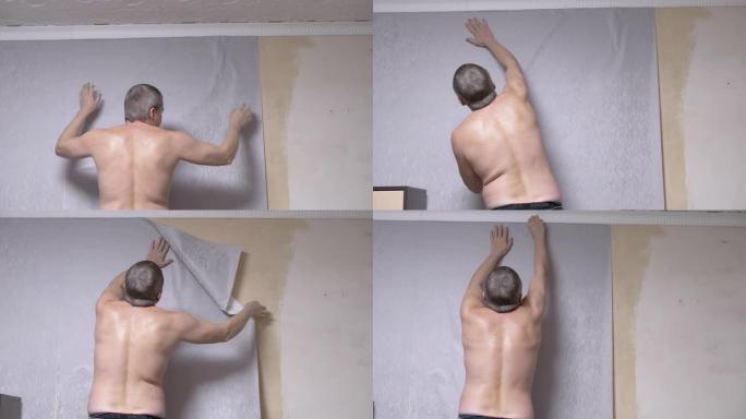男性粘在天花板下的墙上的灰色纸壁纸。后视图。4K