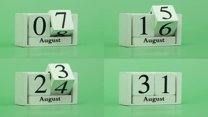 8月月份日历4k停止运动通过手工木制日历在一个月内快速的时间节奏，日期月份和日期放在木桌上