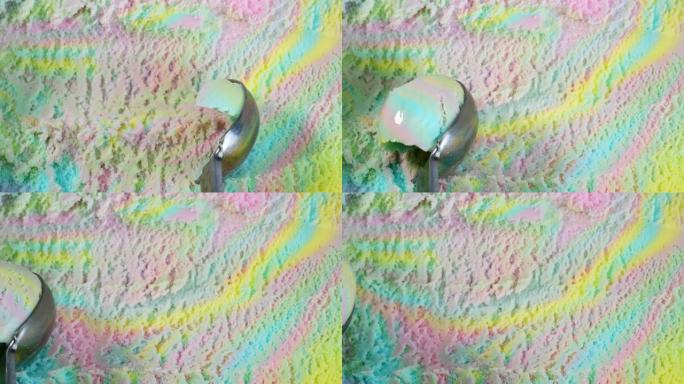 用勺子舀彩虹冰淇淋。