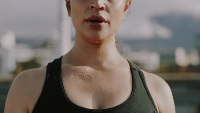 4k视频片段，一个无法识别的女人在城市锻炼时屏住呼吸
