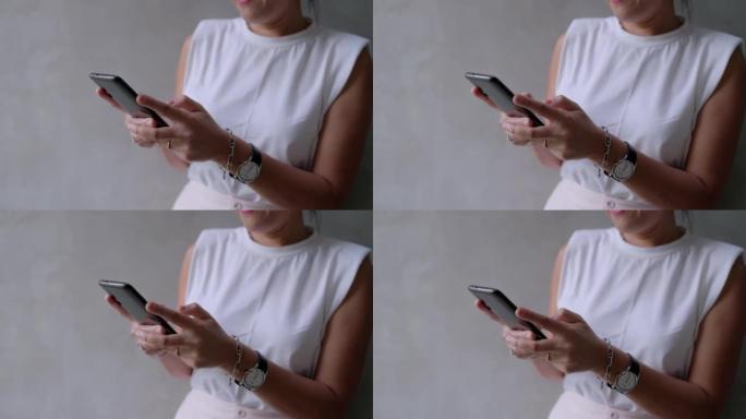 匿名妇女在智能手机上发短信