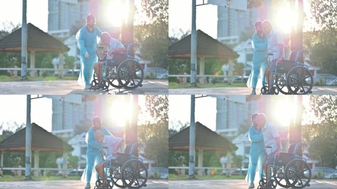 亚洲华裔女性理疗师指导轮椅上的老人伸展腿部