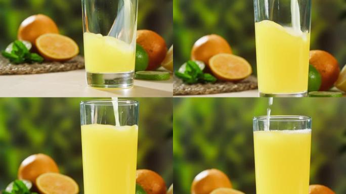 在绿色自然背景上倒橙汁。有机柑橘汁特写。健康的饮食习惯，烹饪成熟水果的鸡尾酒。